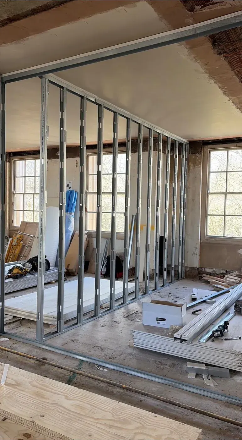 Metal stud partition by the windows
